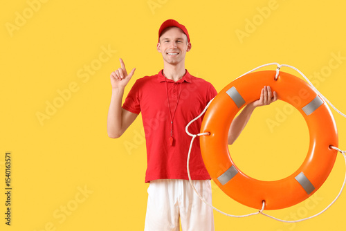 Male lifeguard with rescue ...
