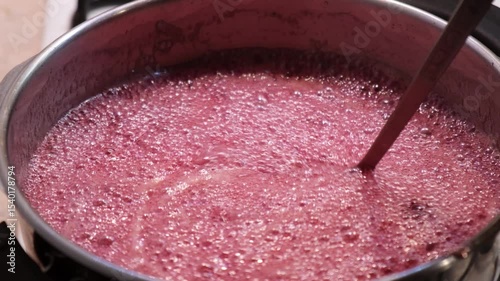 Mixing jam in the pot when boiling in four time slow motion
