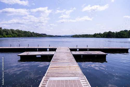 Empty boat docks on the Lac des Nations (Nations Lake) seen during a sunny late spring morning, Sherbrooke, Québec, Canada