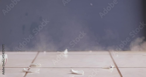 Cup of tea hitting the ground breaking