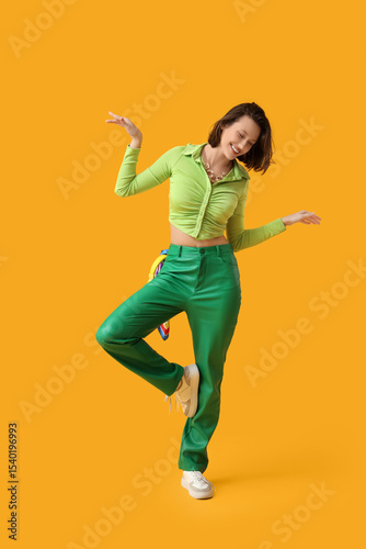 Stylish young woman dancing...
