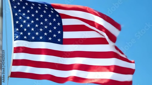American Flag Waving: USA National Symbol of Patriotism, Freedom & Democracy Against Blue Sky. Stars and Stripes. 4K Video Footage.