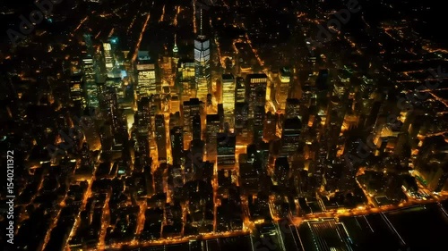 Top-down view of a golden-lit city grid at night