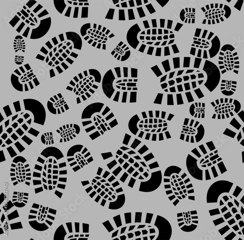 seamless pattern with black boot or shoes print pattern on gray background. Grunge shoe sole texture design for posters, crime scenes, trail art, military, hiking, or urban camouflage.