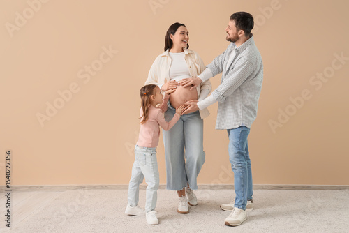 Cute little girl with her f...