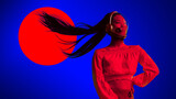 Neon-lit female figure in red top with high ponytail flying sideways inside 3D sci-fi helmet, set against glowing red sun and deep blue gradient background. Concept of futuristic fashion, digital