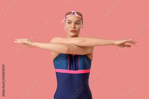 Female swimmer stretching o...