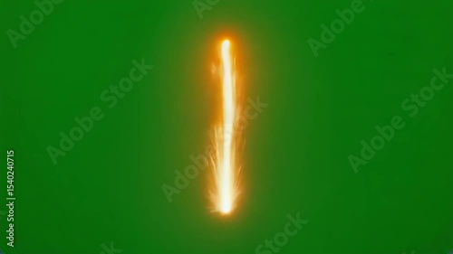 Bright orange spark or flame effect on a green screen background. Isolated visual element for use in digital media and video production.