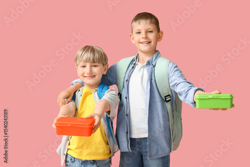Little schoolboys with lunc...