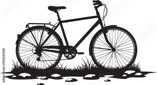 Black silhouette of a bicycle standing in grass and among rocks outdoors