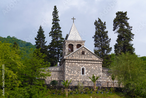 View of the Church of St. John Chrysostom on a cloudy May morning. Kaman Monastery, Abkhazia