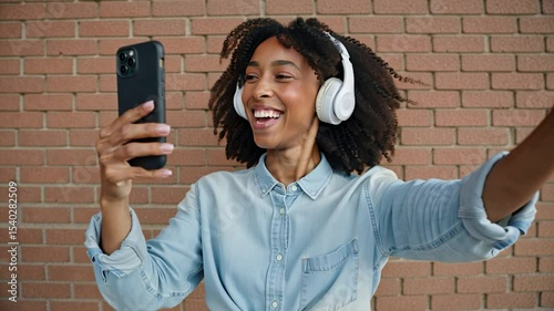 woman immersed in music wearing headphones