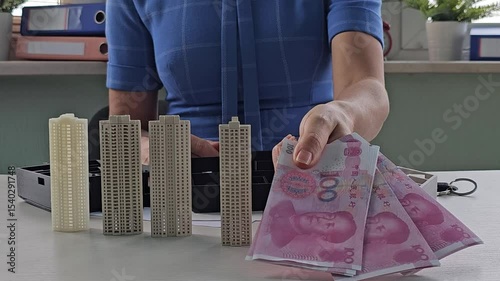Creating architectural models in a workspace with detailed building designs and planning materials