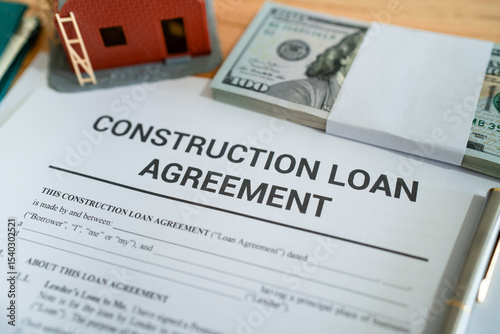 Construction loan agreement contract. Concept of getting in debt to build your house.