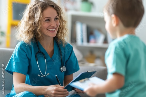 A smiling healthcare professional interacts with a young child, creating a warm and friendly atmosphere in a clinical setting.