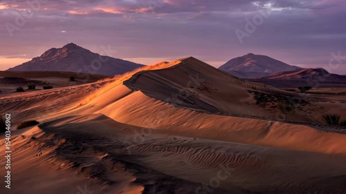 Isolated Sand Dune Casting Long Blue Shadow at Sunset