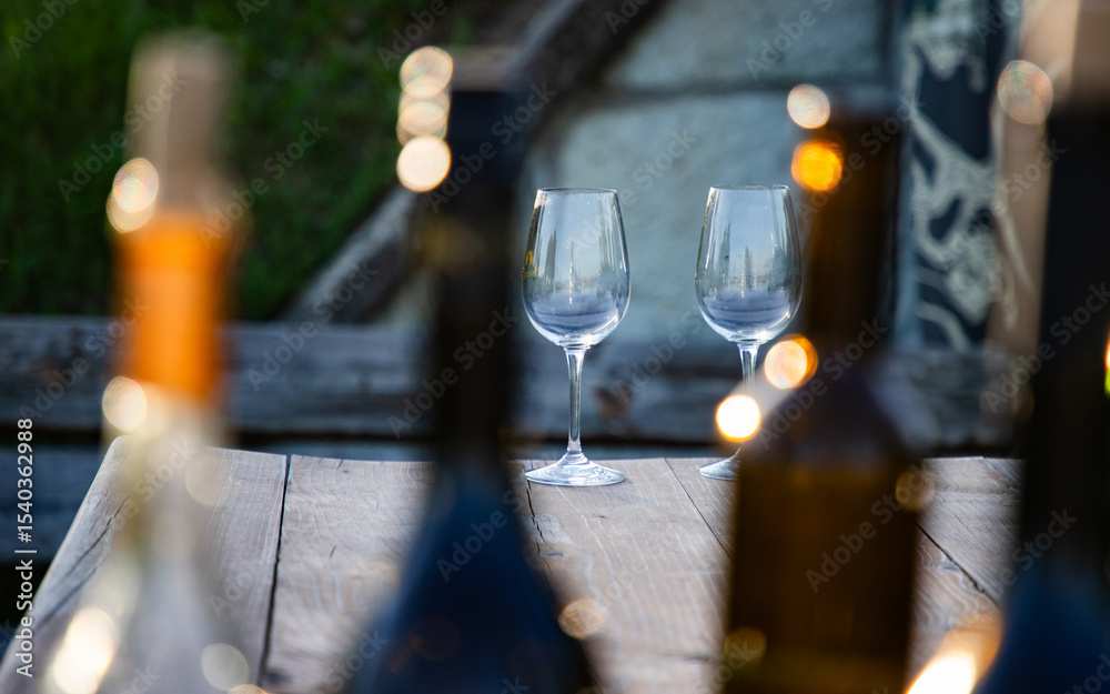 empty wine glass seen through bottles empty wine glass seen through bottles