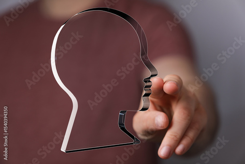 Hand reaching towards a tra...