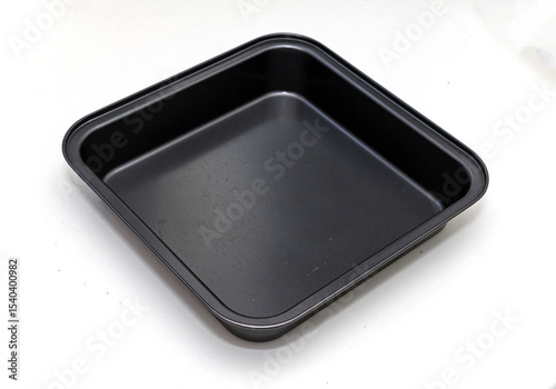 Clean square empty metal pan isolated on white