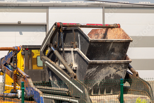 Double skip dump metal container used for disposal of dig up waste material in construction industry outside on a street