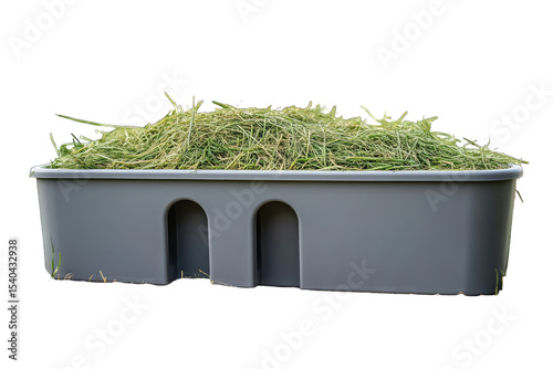 Gray plastic trough filled with hay