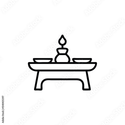 Simple hand drawn altar table with candle and bowls