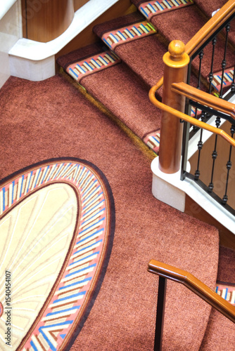 Opulent Art Deco interior architecture inside lobby, atrium or foyer on modern ocean liner style cruiseship cruise ship with staircase, corridors, carpets, chandeliers and art work