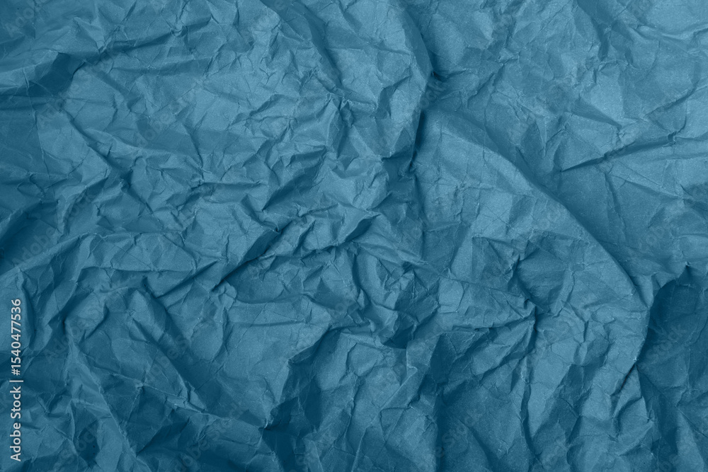 Fototapeta premium Abstract wrinkled blue crumpled paper texture background