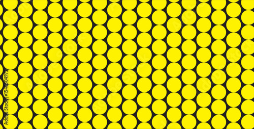 A detailed close up of a yellow and black honeycomb pattern with a repeating oval shape design element