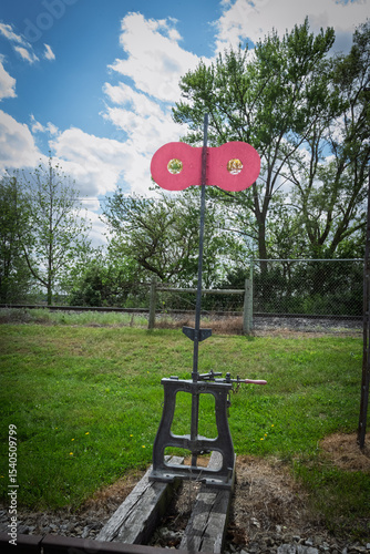 old red and green railway station sign