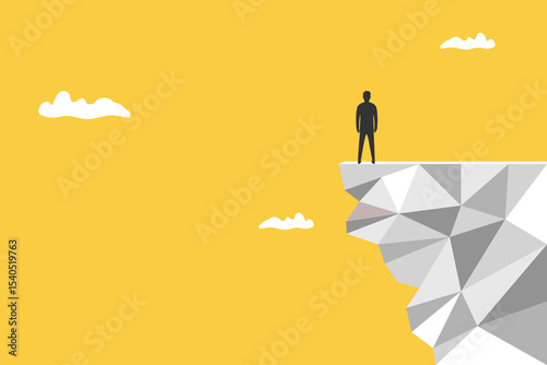 Businessman on the edge of a cliff