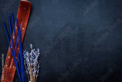 incense sticks with lavander for fresh air on dark background top view mock up