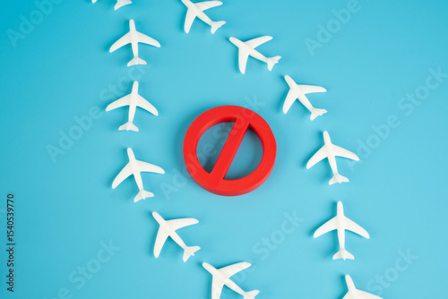 Planes fly around the restricted air zone. Airplanes fly near a restricted air zone, avoiding prohibited areas. Concept of airspace regulation, flight route adjustments, and aviation restrictions.