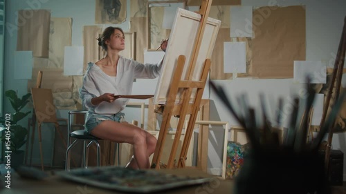 A Female Artist Paints in His Bright, Authentic Studio as Part of Art Therapy, Using Creativity to Work Through Emotional Issues. Concept of Art Therapy for Mental Health and Emotional Healing.