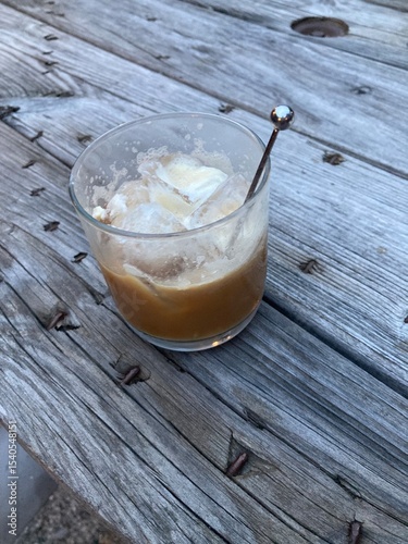 white Russian cocktail on wooden background