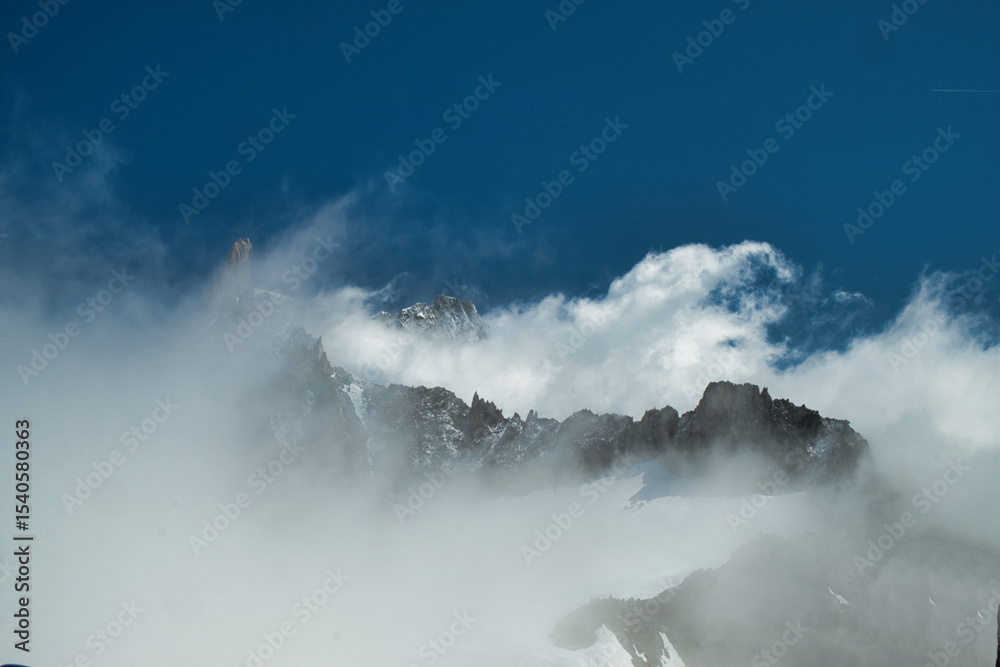 Fototapeta premium View of Mont Blanc in the fog from the Torino refuge, Punta Helbronner, Aosta, Aosta Valley, Italy, Europe