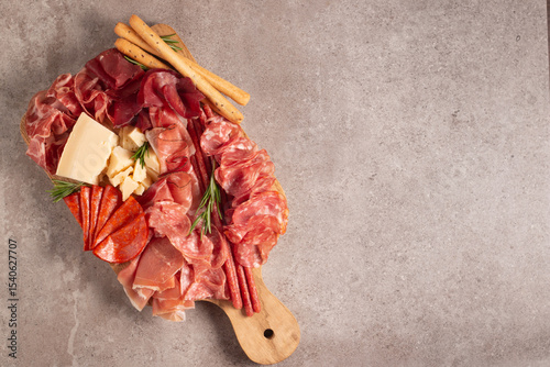 Charcuterie board. Antipasti appetizers of meat platter with salami, prosciutto crudo or jamon and olives.