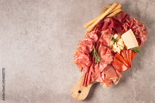 Charcuterie board. Antipasti appetizers of meat platter with salami, prosciutto crudo or jamon and olives.