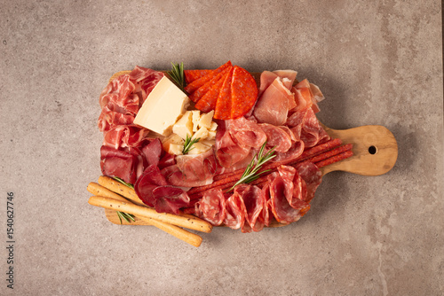 Charcuterie board. Antipasti appetizers of meat platter with salami, prosciutto crudo or jamon and olives.