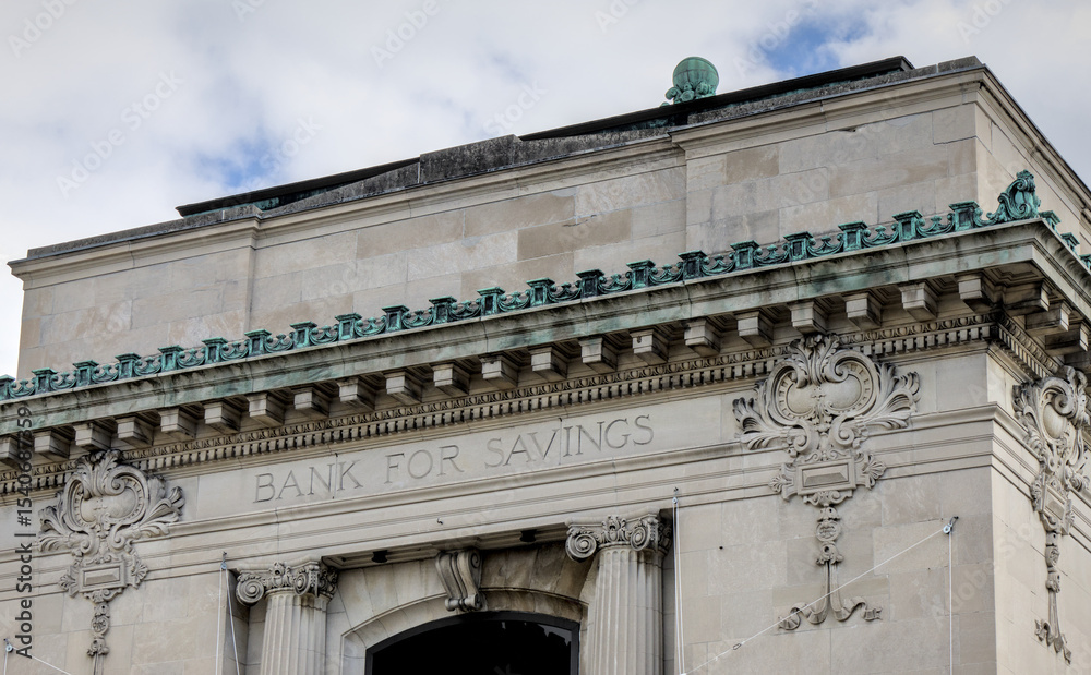 Obraz premium Bank for Savings sign above historic building entrance in Ossining, New York.