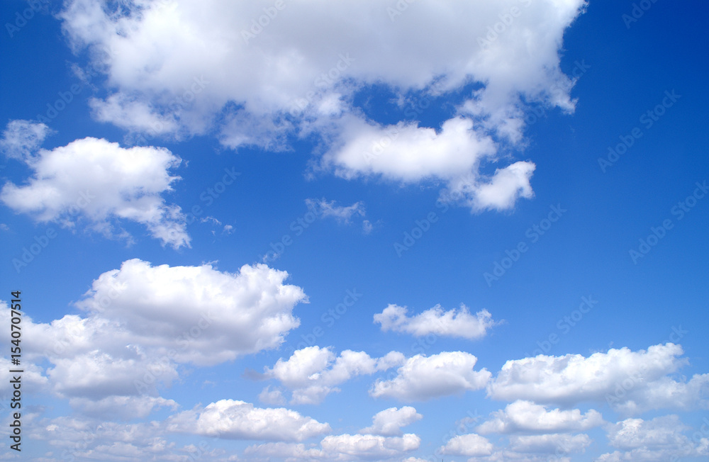 Fototapeta premium Bright sunny day, blue sky with white clouds