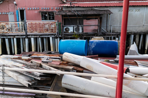 Construction waste near stilt house photo