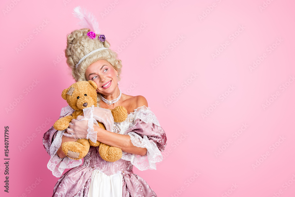 Fototapeta premium Elegant woman in vintage royal attire holding a teddy bear against a pink backdrop, evoking historical charm and humor