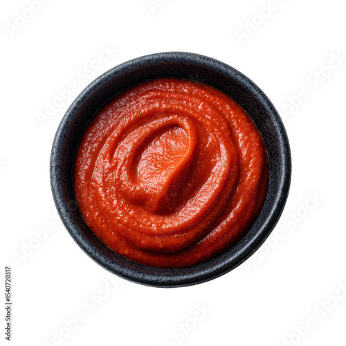 Delicious, vibrant red tomato paste in a black bowl on a white isolate background, perfect for culinary inspiration and recipes.