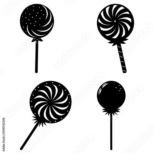 Four black and white lollipops with different designs and patterns on a white background displayed nicely