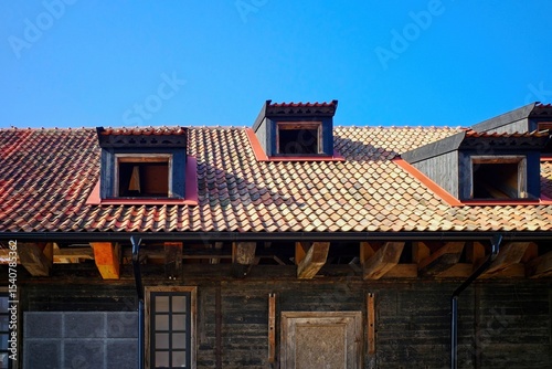 Restoration of a historic building with a tiled roof.
