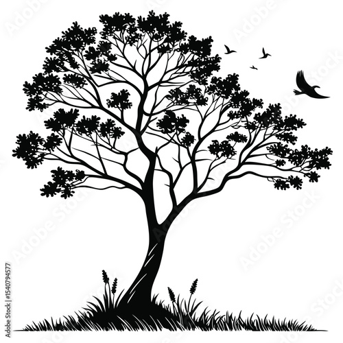 Black tree silhouette standing tall in a grassy field with birds flying peacefully
