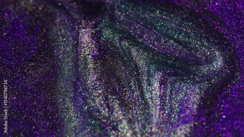 Swirling motion of violet glitter mixed with silver in a flowing pattern. Smooth transitions and sparkling highlights create a dynamic abstract texture.