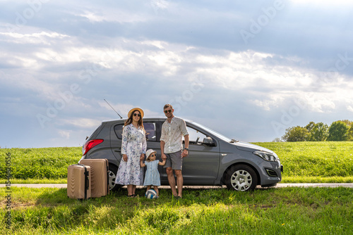 Family with child. Travel by car journey. Luggage sunshine weekend cheerful.