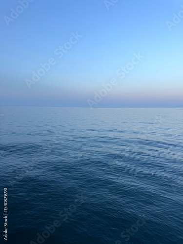 Blue sea calm waters and blue sky.
